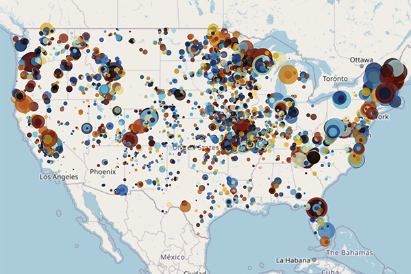 A map of the United States with colorful circles depicting sampling locations for soil organic carbon and properties from 1985 to 2021.