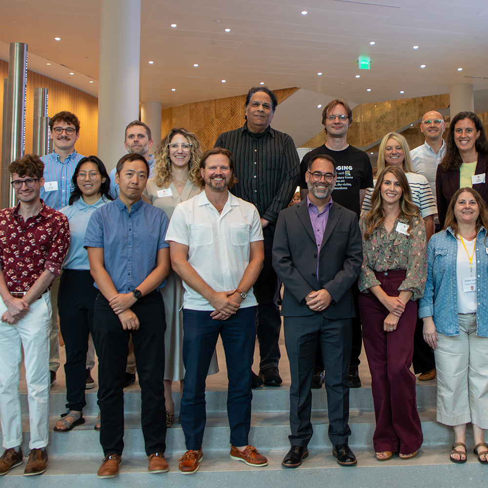 DSI staff members standing in rows on steps in Morgridge Hall.