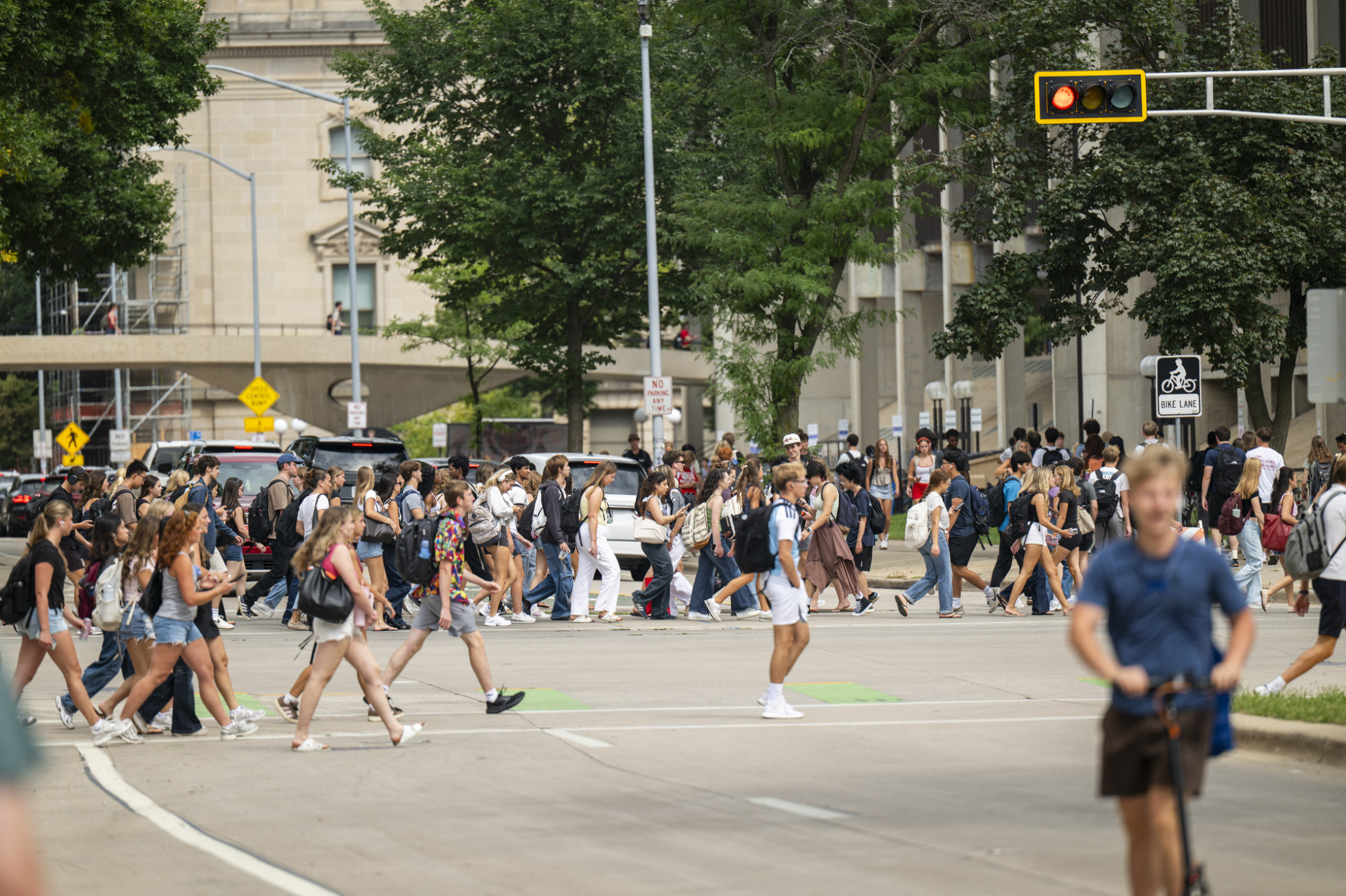 The hustle and bustle of a new fall semester fills the intersection of North Park Street and University Avenue during a passing period on the first day of classes.