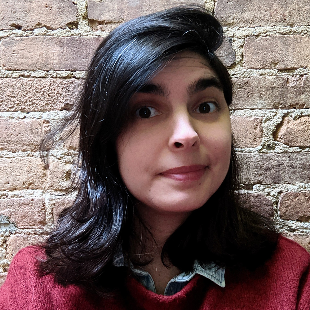 A picture of Eleonora Tronci. She has black hair and a red sweater.