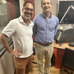 Kyle Cranmer and Lee Rayburn standing in a radio studio.