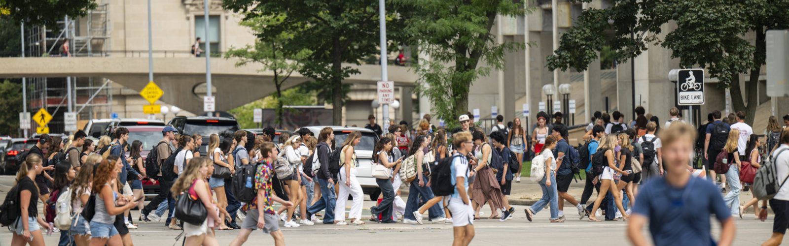 The hustle and bustle of a new fall semester fills the intersection of North Park Street and University Avenue during a passing period on the first day of classes.